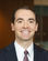 Andrew Bosserman, founder of Boss Tax Law, professional headshot in navy suit and patterned tie